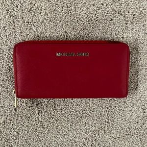 Michael Kors red wallet. Gently used. Non smoking.